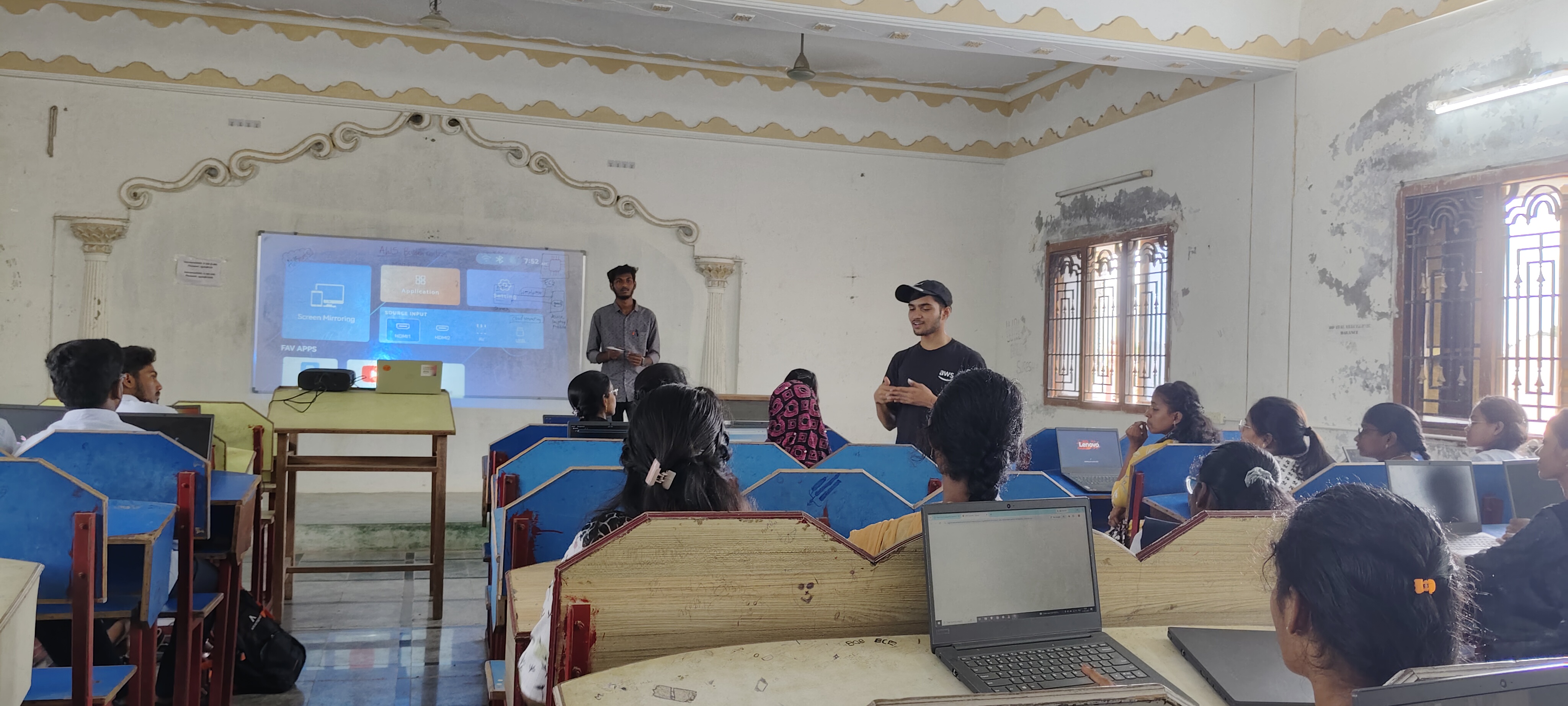 Student presentation in progress with visual slides